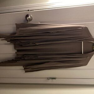 Size 1X tope color long sleeve has tassels on the bottom